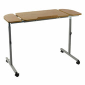 NRS adjustable over bed and chair table with wood top, side extensions and wheeled metal legs, angled front view.