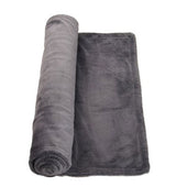 Dark grey fleece heated lap blanket, partially rolled up on a white surface, angled view.