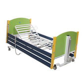 Junior profiling bed with green and yellow headboards, blue rails, wheels, and remote control adjustment, side view.