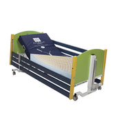 Hospital bed with raised head, green and blue side rails, on wheels, Sidhil Acclaim VE Junior mattress for pressure relief, front angle view.