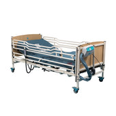 Sidhil Solite Pro Side Rail Height Extension on hospital bed with blue mattress, wood panels, wheels, and control panel, side view.