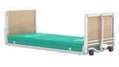 Low-height profiling bed with wooden headboards and green mattress, side view.