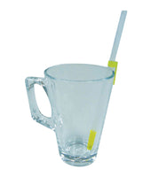 Clear glass mug with large handle, one way drinking straw held by two yellow clips on the rim and side, front view.