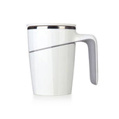 White anti-spill mug with diagonal design, suction base and angled handle on white background, front view.