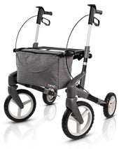Blue Topro Olympos All Terrain rollator with four large wheels, ergonomic handles and fabric storage bag, front angle view.