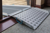 Aerolight Up & Over Ramp Kit for bridging doorways, shown linking indoor and outdoor surfaces, angled side view.