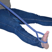 Aidapt Leg Lifter Aid being used by a person in blue jeans to lift their leg, white background, in use view.