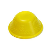 Yellow dome-shaped silicone bottle opener with grip bars, textured sides, and Tenura logo, front view.