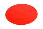 Red Tenura non-slip coaster with oval pattern and textured edge on a white background, top view.