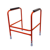 Red toilet frame with black hand grips, four rubber-tipped legs and adjustable height, front view.