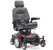 Black and red mid-wheel powerchair with padded seat, armrests, footrest and joystick, front view.