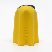 Small yellow one-finger cutting tool with a ceramic blade and nimble embossed on the front, front view.