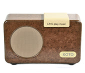 Red rectangular Simple Music Player by E2L, beige Lift to play music button on top, E2L logo front lower right, front view.