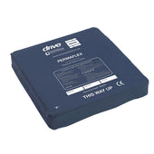 Navy blue Permaflex cushion with castellated surface, white THIS WAY UP label and branding, for patient support, front view.