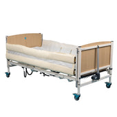 Hospital bed with wooden ends, protective side rail pad and castor wheels, standard model, side view.
