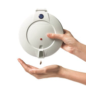 Pivotell Mk3 Automatic Pill Dispenser releasing a pill into an open hand, in use view.
