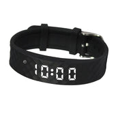 Red digital watch with LED display and vibration reminder feature, Pivotell Vibratime, front view.