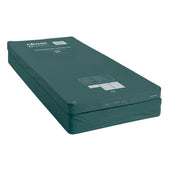 Dark green foldable overlay mattress with printed labels and waterproof cover, shown from above.