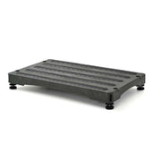 Low grey rectangular step with a non-slip surface and adjustable feet at each corner, front angle view.