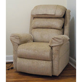 Mink wall hugging riser recliner chair with cushioned arms and backrest on a wooden floor, front angle.