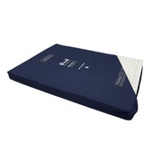 Harvest Healthcare Reflect 2 4ft mattress with partially removed cover showing foam core for pressure relief, angled view.