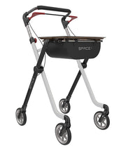 White and black Rehasense Space I Indoor Rollator with height adjustable handles and storage compartment, side view.