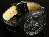 Lifemax chronograph style talking watch with multiple sub-dials and a leather strap, on a reflective black surface, angled view.