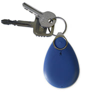White Chiptech GO Pendant with two silver keys on a ring, close-up view.