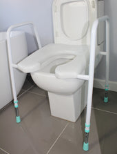 Height adjustable mens toilet aid with armrests, fits standard toilets for added support, side view.