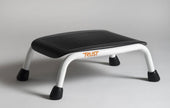 Black and white ribbed bath step with four sturdy legs, modern design, side angle view.