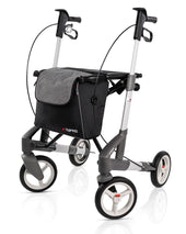 Silver Topro Troja 5G Premium Rollator with four wheels, black bag, and ergonomic handles, front angle.