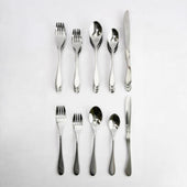 Five-piece Buckingham Knork cutlery set arranged in two rows on a white background, top view.