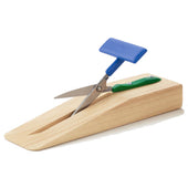 Table top scissors with green handle, blue lever, and wooden base for stability, side view.