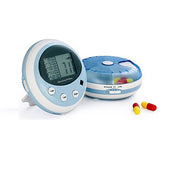Blue and white Pivotell Minitell Alarmed Pillboxes with two red and yellow capsules, on a white surface, front view.