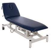 Storm Blue 2 section electric exam table with white frame and headrest hole, front angle.