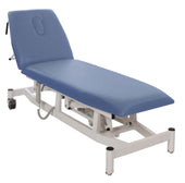 Drive Doherty two section plinth in blue with electric adjustable backrest, white metal frame and castors, side view.