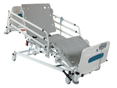 Sidhil Innov8 iQ hospital bed with side rails, remote control, wheeled base and adjustable head and leg sections, side view.