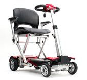 Red and silver folding mobility scooter with black seat, armrests, and Delta bar, side view.
