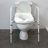 Adjustable width toilet seat and frame fitted to a standard toilet in a tiled bathroom, front view.