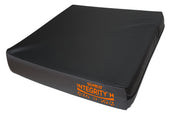 Black rectangular Sumed Integrity Static Cushion for high risk, orange text on surface, white background, front angle view.