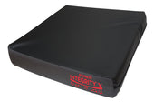 Black seat cushion with red branding and a slightly angled corner for pressure relief, front view.