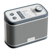 Grey and white dementia radio with retro style and simple controls for genre, power, and volume, front view.