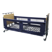 Mesh side rails fitted to an ultra low bed with wooden headboard, footboard and wheels, side view.