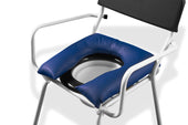 U-shaped commode cushion on a white chair with a black backrest, shown in use.