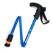 Blue Flexyfoot folding walking stick with Derby handle, soft grip, black strap, and Flexyfoot ferrule, shown folded, side view.