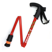 Red Flexyfoot folding walking stick with Derby handle, soft grip, wrist strap and shock-absorbing ferrule, side view.