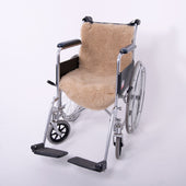 Tan pure wool seat and backrest cover for wheelchair, displayed on a white background, front view.