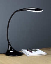 Silver Lifemax High Vision LED desk light on a wooden desk with closed notebook and pen, grey background, in use side view.