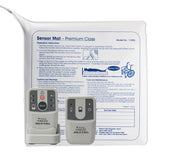 Lifemax Nutrix wireless alert set with chair mat, two control devices and instructions for patient monitoring, angled front view.