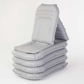 Grey inflatable lifting chair with backrest, stackable design, shown for home use, front angle.